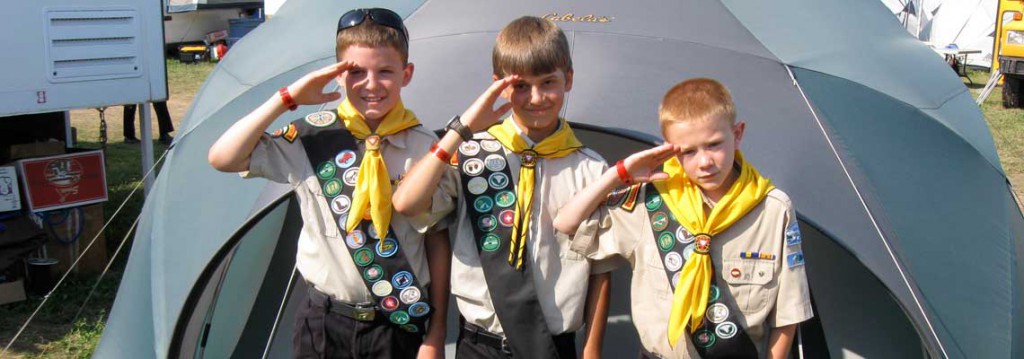 Kids in uniform by tent