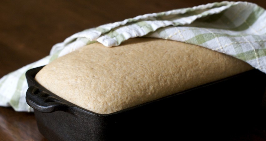 Bread rising in a cast iron baking pan