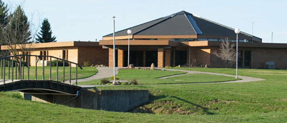 Photo of UCA church & front lawn in summer